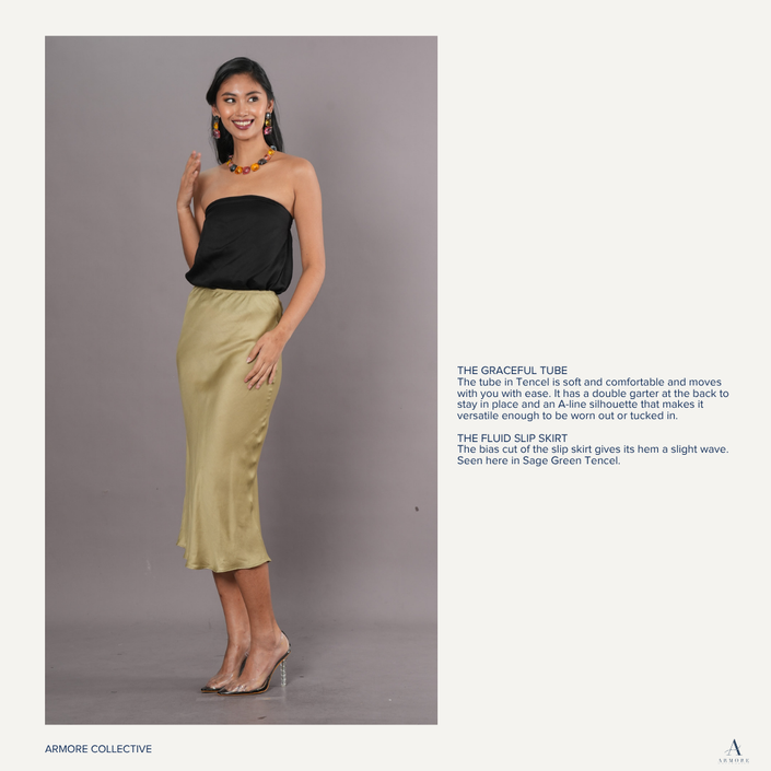 Woman wearing a black tube top and olive green tencel skirt