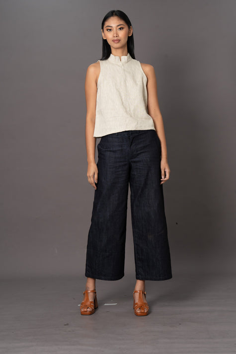 denim wide leg trousers with white halter neck top