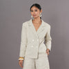 Woman wearing an Easy Tailored Blazer in  Sand